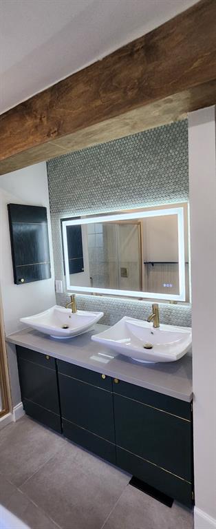 3157 NW 25th St, Oklahoma City, OK 73107 - full bath with double vanity and tile patterned floors