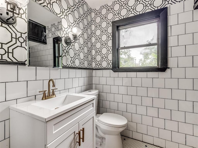 3157 NW 25th St, Oklahoma City, OK 73107 - bathroom with vanity, tile walls, tile patterned floors, and wallpapered walls
