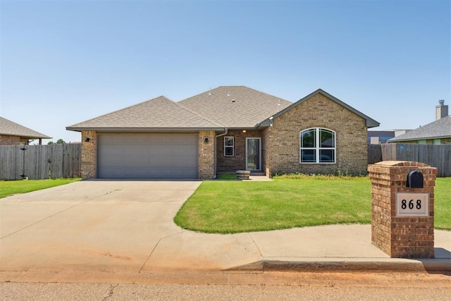 868 Phils Way, Piedmont, OK 73078 - view of front of house with an attached garage, brick siding, concrete driveway, and roof with shingles