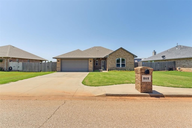 868 Phils Way, Piedmont, OK 73078 - view of front of property featuring an attached garage, concrete driveway, and brick siding