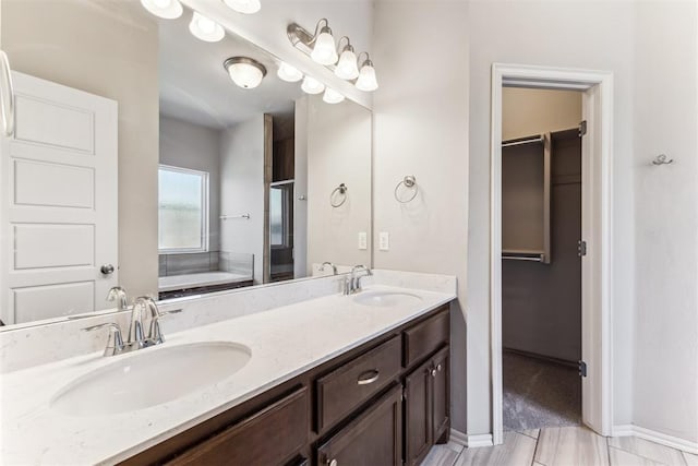 868 Phils Way, Piedmont, OK 73078 - full bathroom featuring double vanity, a bath, and a walk in closet