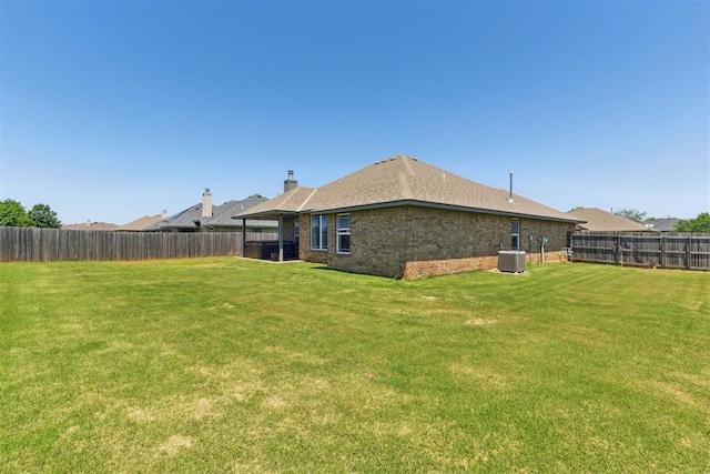 868 Phils Way, Piedmont, OK 73078 - rear view of property with a fenced backyard and brick siding