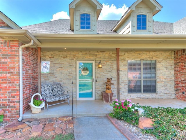 3393 Creek View Ct, Newcastle, OK 73065 - view of exterior entry featuring roof with shingles and brick siding