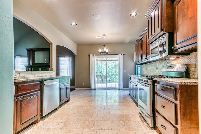 3393 Creek View Ct, Newcastle, OK 73065 - kitchen with stainless steel appliances, stone tile floors, plenty of natural light, decorative backsplash, and recessed lighting