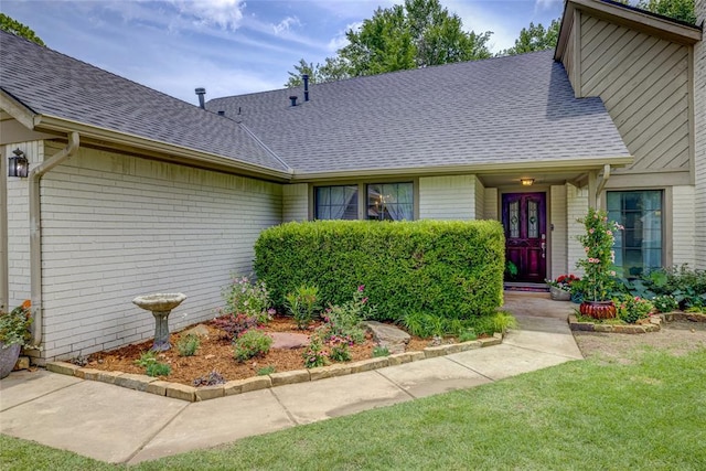 2010 Trailview Ct, Norman, OK 73072 - view of front of property with a shingled roof, brick siding, and a front yard