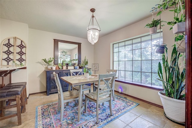2010 Trailview Ct, Norman, OK 73072 - dining space featuring healthy amount of natural light, baseboards, and a chandelier