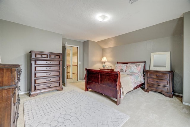 2010 Trailview Ct, Norman, OK 73072 - bedroom with light carpet, baseboards, and a textured ceiling
