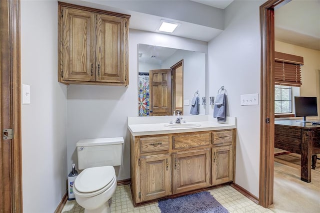 2010 Trailview Ct, Norman, OK 73072 - bathroom with tile patterned floors, vanity, toilet, and baseboards