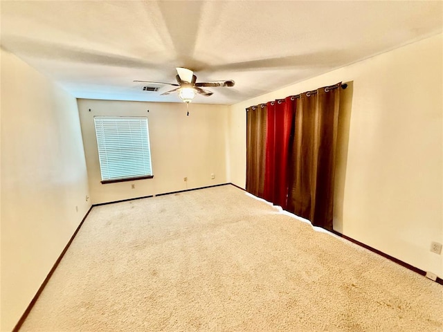 4400 Hemingway Dr Unit 263, Oklahoma City, OK 73118 - empty room with a ceiling fan, baseboards, and carpet