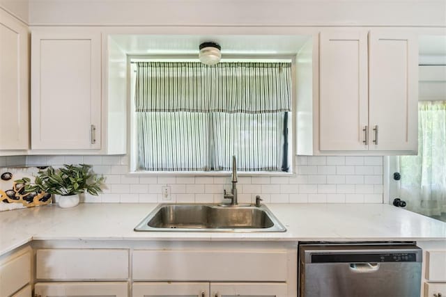 3029 NW 65th St, Oklahoma City, OK 73116 - kitchen featuring dishwasher, white cabinetry, and decorative backsplash