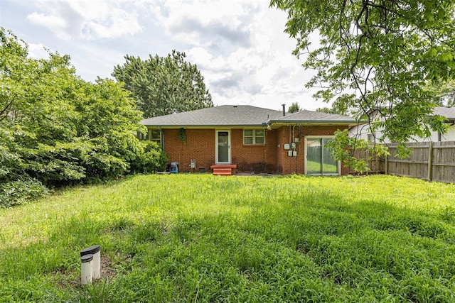 3029 NW 65th St, Oklahoma City, OK 73116 - back of property featuring entry steps and brick siding