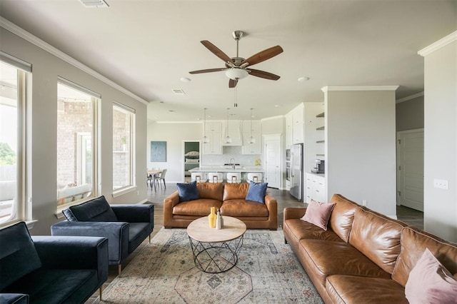 10800 NW 5th St, Yukon, OK 73099 - living room with a ceiling fan, dark wood finished floors, crown molding, and recessed lighting