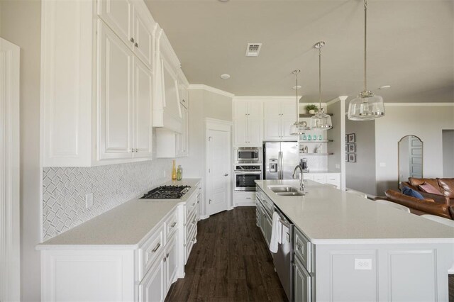 10800 NW 5th St, Yukon, OK 73099 - kitchen with stainless steel appliances, white cabinetry, dark wood-style floors, decorative backsplash, and light countertops