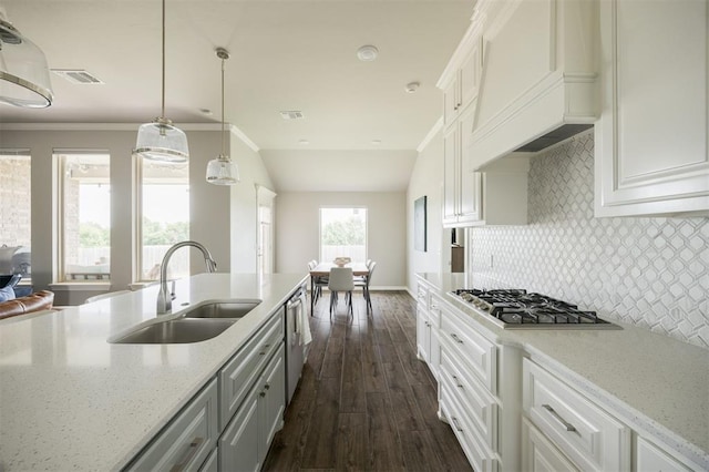 10800 NW 5th St, Yukon, OK 73099 - kitchen with stainless steel appliances, dark wood-style flooring, decorative backsplash, light stone counters, and white cabinetry