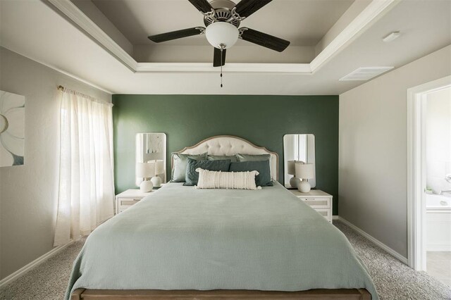 10800 NW 5th St, Yukon, OK 73099 - carpeted bedroom with a raised ceiling and ceiling fan