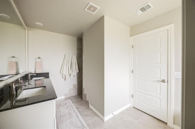 10800 NW 5th St, Yukon, OK 73099 - full bath featuring double vanity and tile patterned flooring