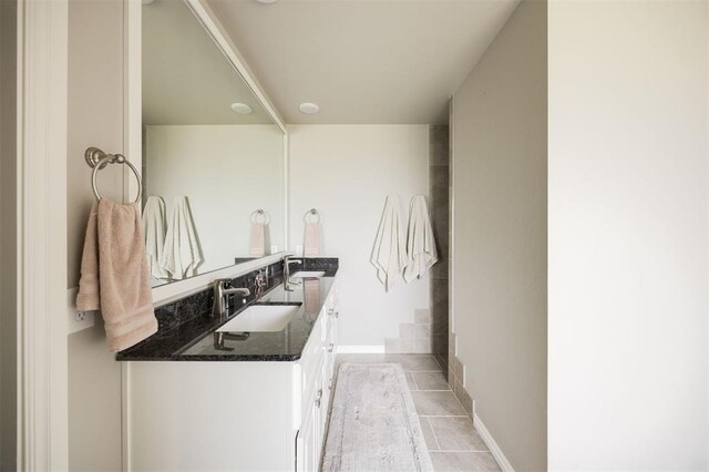 10800 NW 5th St, Yukon, OK 73099 - full bathroom featuring double vanity and tile patterned floors