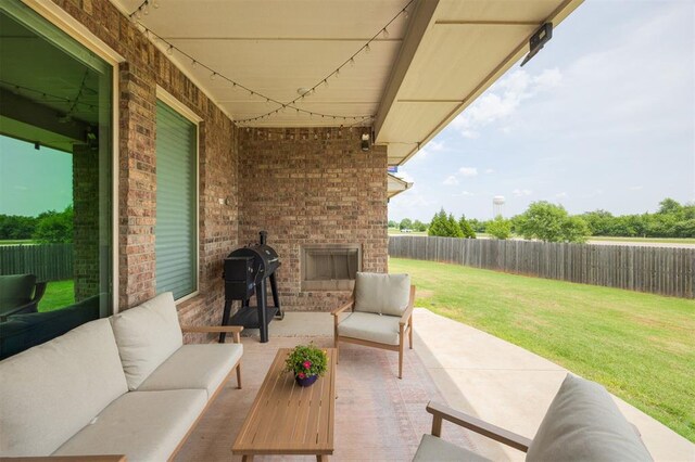 10800 NW 5th St, Yukon, OK 73099 - fenced backyard with an outdoor living space with a fireplace and a patio area
