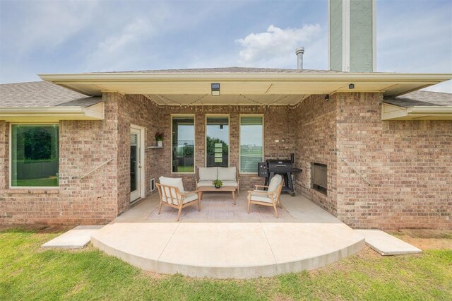10800 NW 5th St, Yukon, OK 73099 - view of patio with an outdoor living space with a fireplace