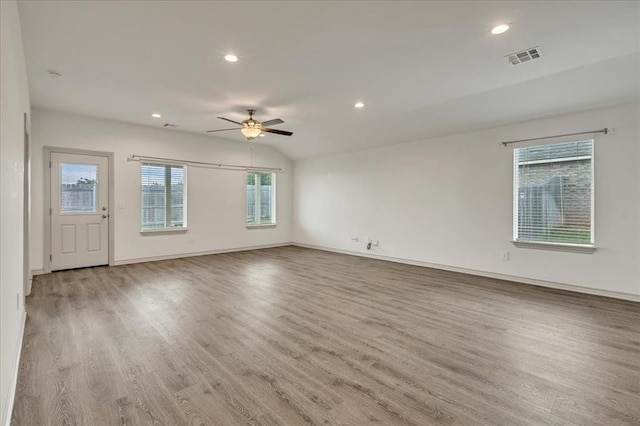14500 Gravity Falls Ln, Oklahoma City, OK 73142 - empty room featuring a ceiling fan, wood finished floors, recessed lighting, and lofted ceiling