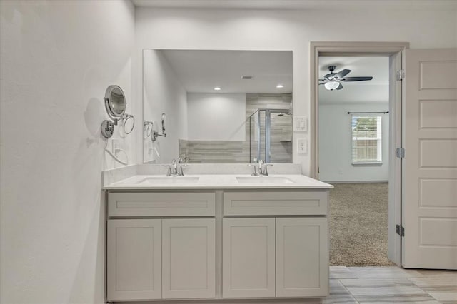 14500 Gravity Falls Ln, Oklahoma City, OK 73142 - full bathroom featuring double vanity, a shower stall, and ceiling fan