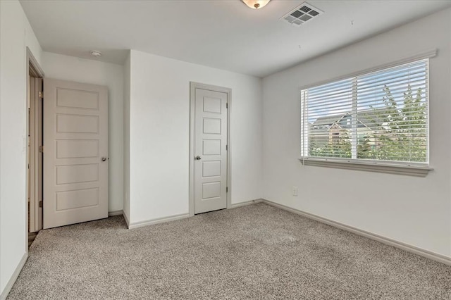 14500 Gravity Falls Ln, Oklahoma City, OK 73142 - unfurnished bedroom featuring light colored carpet and baseboards