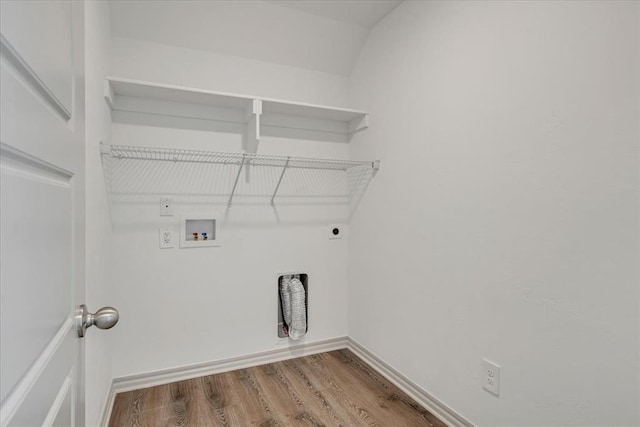 14500 Gravity Falls Ln, Oklahoma City, OK 73142 - washroom with washer hookup, hookup for an electric dryer, and wood finished floors