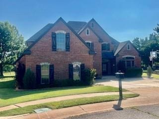 3805 Highridge, Edmond, OK 73003 - tudor house featuring a front yard