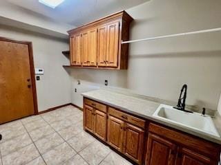 3805 Highridge, Edmond, OK 73003 - washroom featuring cabinet space, hookup for a washing machine, and light tile patterned floors