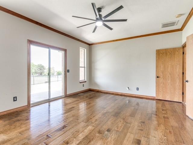 3805 Highridge, Edmond, OK 73003 - empty room featuring ornamental molding, ceiling fan, and wood finished floors