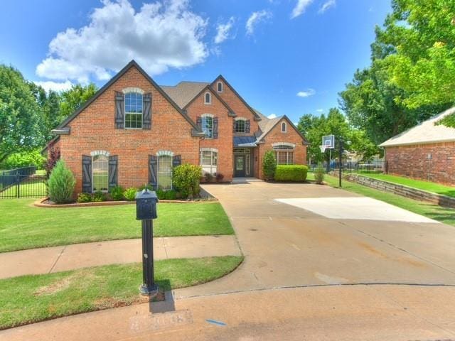 3805 Highridge, Edmond, OK 73003 - view of front of house featuring driveway and brick siding