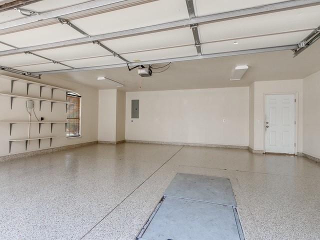 3805 Highridge, Edmond, OK 73003 - garage featuring a garage door opener and electric panel