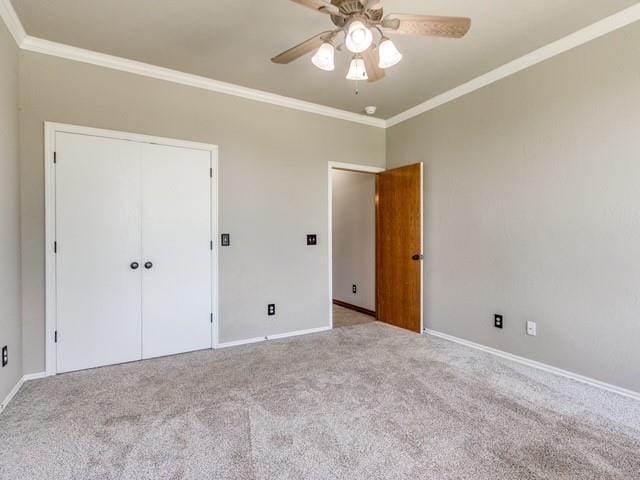 3805 Highridge, Edmond, OK 73003 - unfurnished bedroom with crown molding, carpet, a closet, and ceiling fan