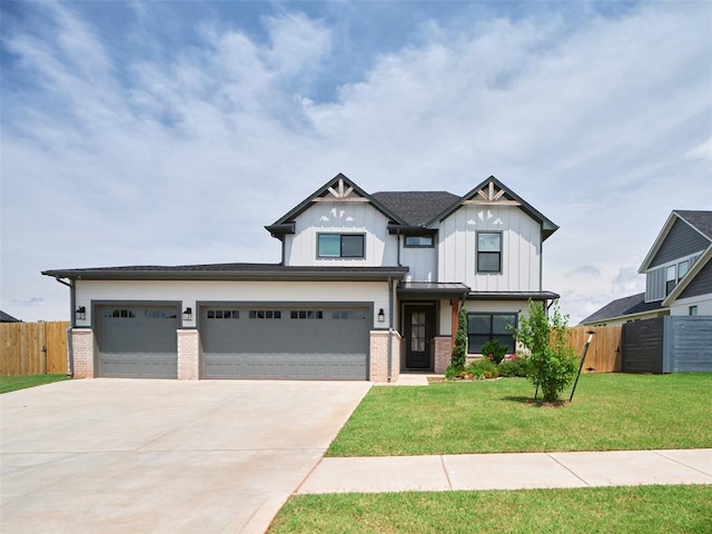 19608 Dalemead Way, Edmond, OK 73012 - view of front facade with brick siding, concrete driveway, board and batten siding, and an attached garage