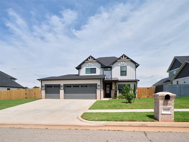 19608 Dalemead Way, Edmond, OK 73012 - view of front of home with board and batten siding, concrete driveway, brick siding, and a garage