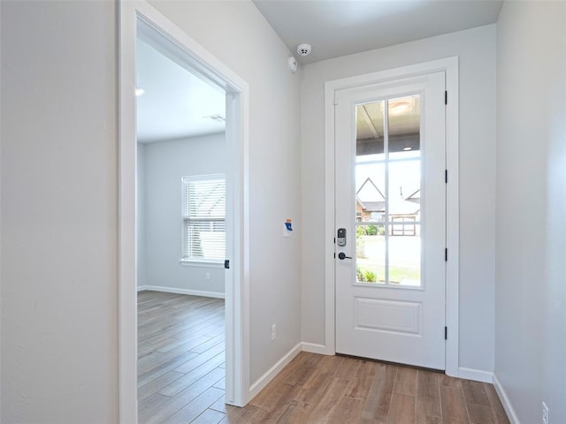 19608 Dalemead Way, Edmond, OK 73012 - doorway featuring light wood finished floors and healthy amount of natural light