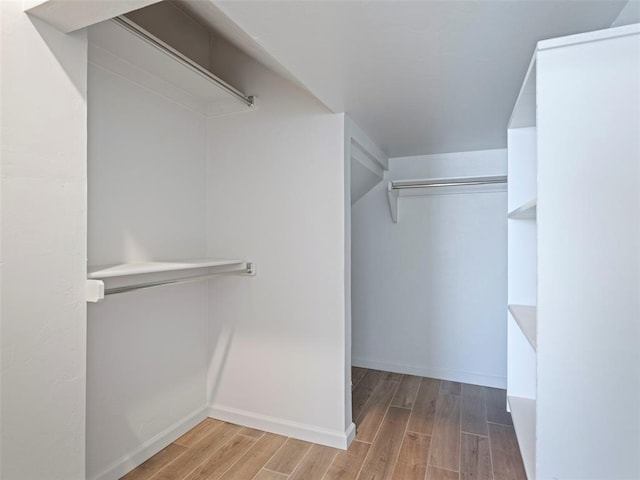 19608 Dalemead Way, Edmond, OK 73012 - walk in closet with wood finished floors