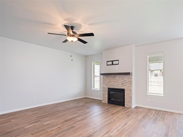 19608 Dalemead Way, Edmond, OK 73012 - unfurnished living room with ceiling fan, light wood-style floors, and a fireplace
