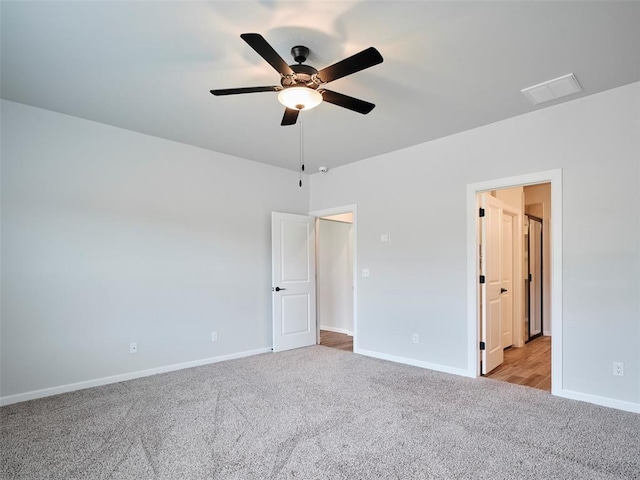 19608 Dalemead Way, Edmond, OK 73012 - unfurnished bedroom featuring light colored carpet and a ceiling fan