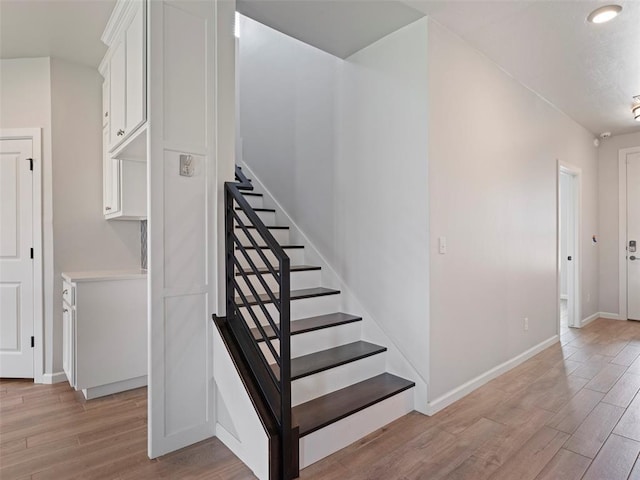 19608 Dalemead Way, Edmond, OK 73012 - stairs with wood finished floors