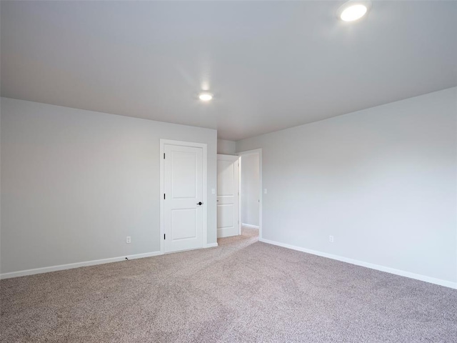 19608 Dalemead Way, Edmond, OK 73012 - empty room with carpet flooring and recessed lighting