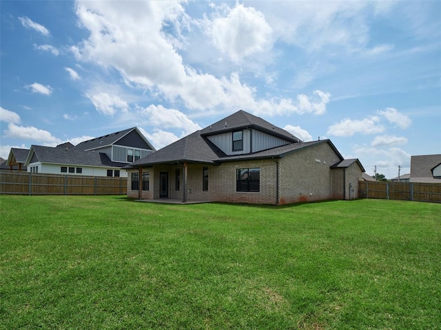 19608 Dalemead Way, Edmond, OK 73012 - back of house featuring a fenced backyard, brick siding, and a patio