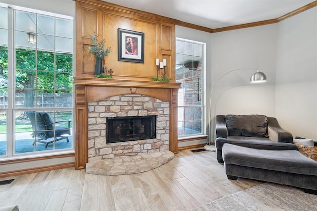2917 Stafford Rd, Edmond, OK 73012 - living area featuring crown molding, wood finished floors, and a fireplace