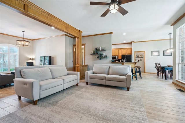 2917 Stafford Rd, Edmond, OK 73012 - living area featuring plenty of natural light, light wood finished floors, a chandelier, ornamental molding, and recessed lighting