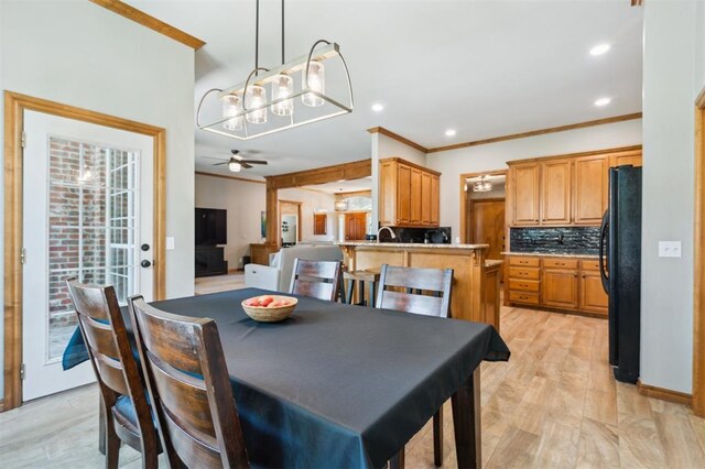 2917 Stafford Rd, Edmond, OK 73012 - dining area with ornamental molding, recessed lighting, a chandelier, a ceiling fan, and light wood-type flooring