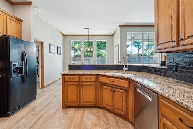 2917 Stafford Rd, Edmond, OK 73012 - kitchen featuring black fridge with ice dispenser, dishwasher, ornamental molding, brown cabinets, and light stone countertops