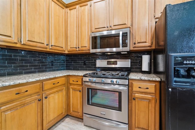 2917 Stafford Rd, Edmond, OK 73012 - kitchen with stainless steel appliances, tasteful backsplash, and light stone countertops