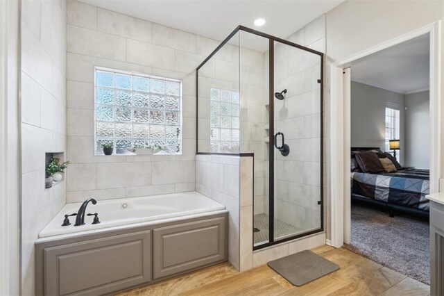 2917 Stafford Rd, Edmond, OK 73012 - bathroom featuring ensuite bath, a bath, a shower stall, and ornamental molding