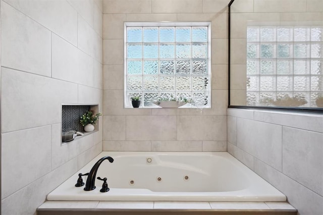 2917 Stafford Rd, Edmond, OK 73012 - bathroom with a tub with jets and tile walls