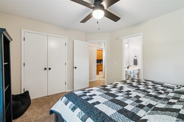 2917 Stafford Rd, Edmond, OK 73012 - bedroom featuring light colored carpet, a closet, a ceiling fan, and connected bathroom